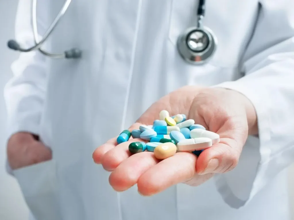 Man holding oral sedation pills