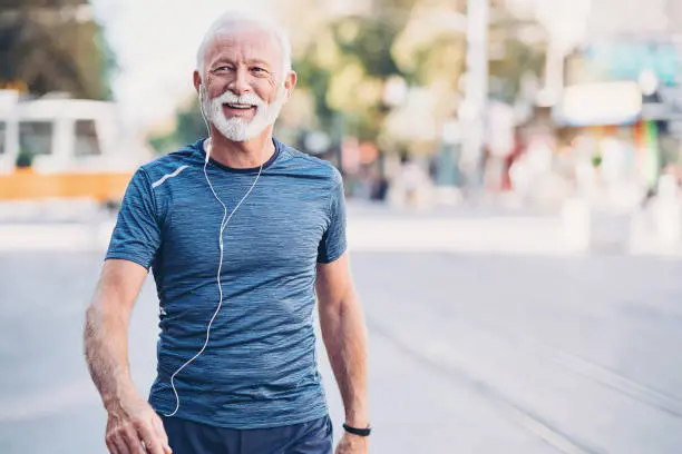 healthy adult male walking with full mouth dental implants